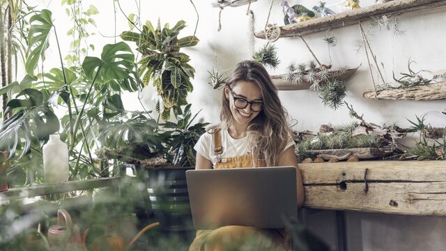 Happy woman using laptop